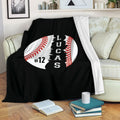 Baseball blanket draped over a sofa in a cozy living room setting