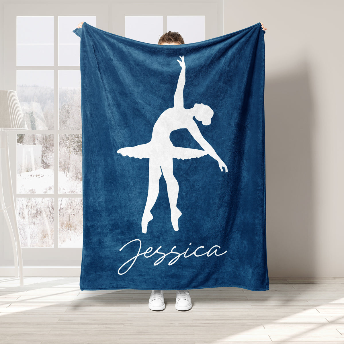 Navy blue ballet throw blanket featuring a white ballerina silhouette in a dance pose