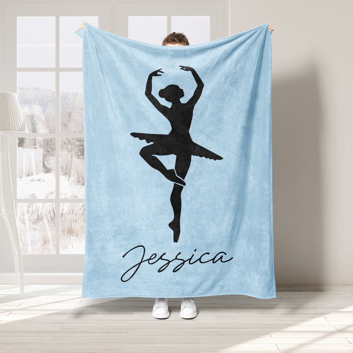 Light blue ballet throw blanket featuring a black dancer silhouette in an elegant pose