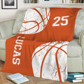 Orange basketball blanket draped over a sofa, creating sporty lounge and bedroom decor