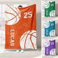 Orange basketball throw blanket with bold white basketball graphics and several color variations