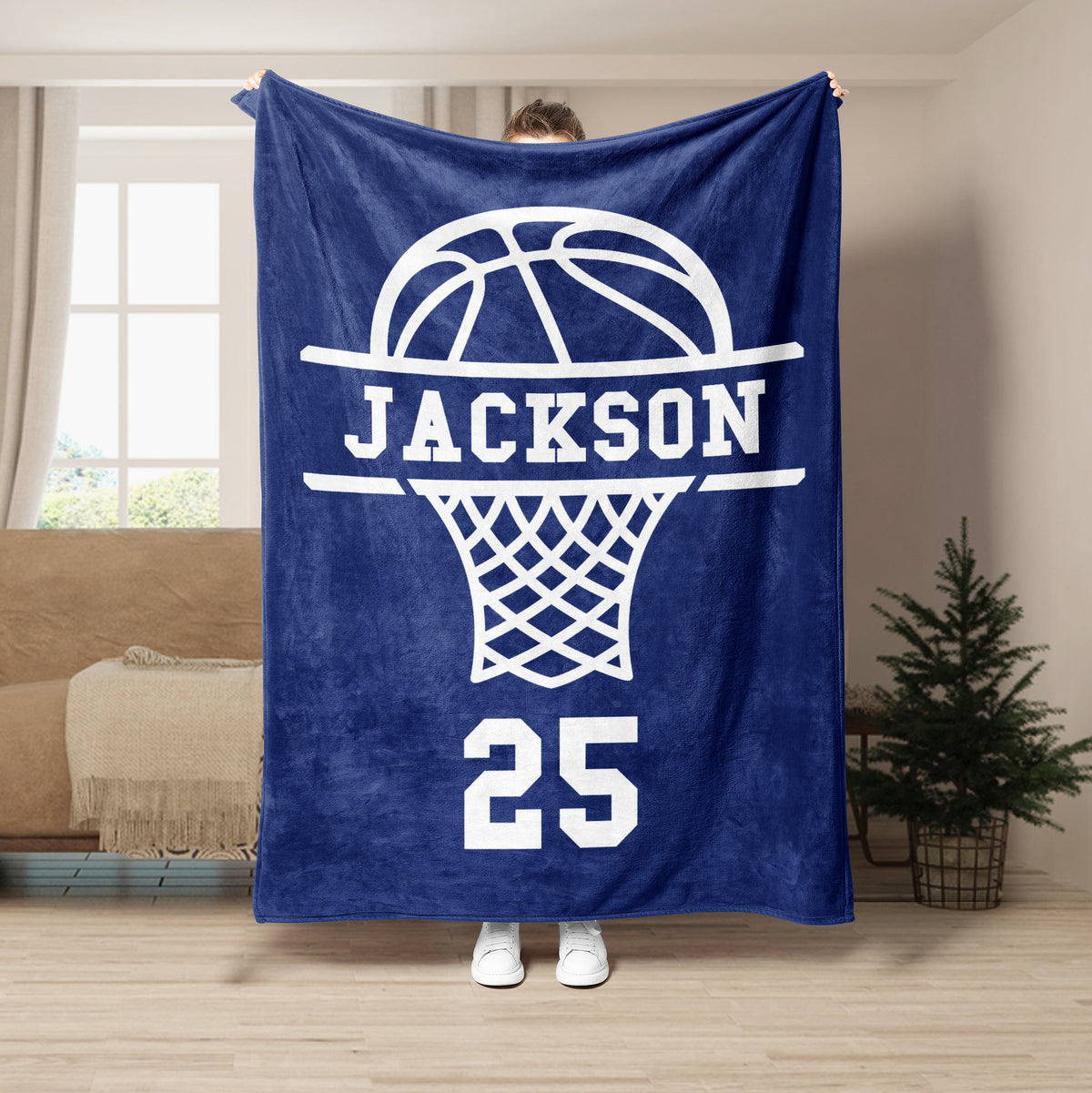 Navy basketball throw blanket displayed in a living room with a large white hoop design
