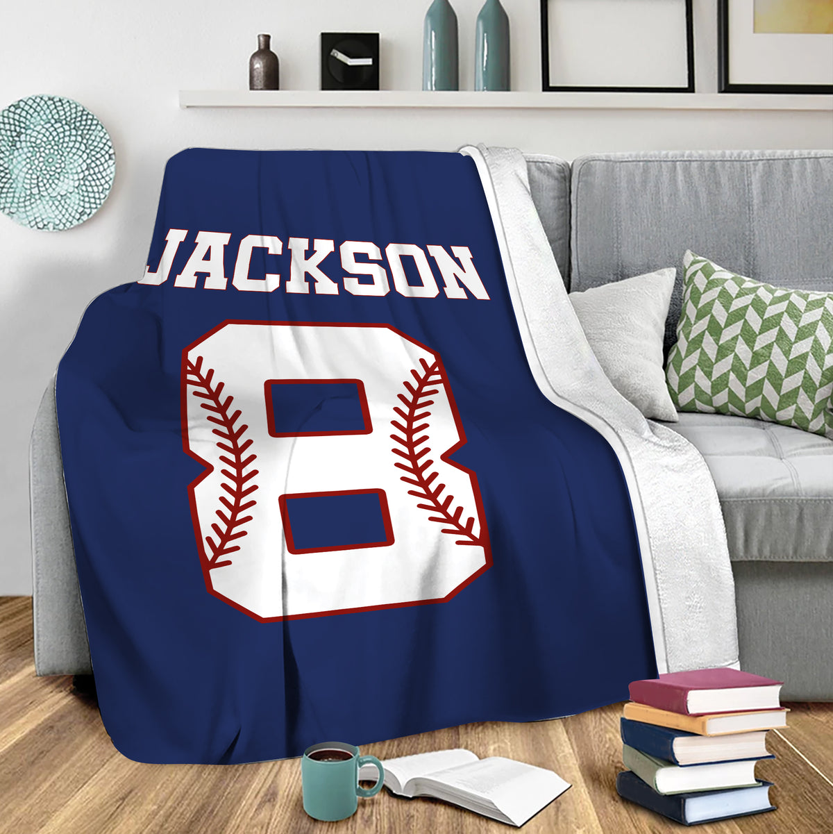 Baseball throw blanket draped over a sofa in a cozy living room with bold navy sports artwork