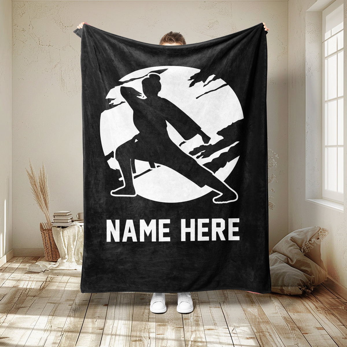 Black karate throw blanket featuring a martial artist in a wide defensive stance