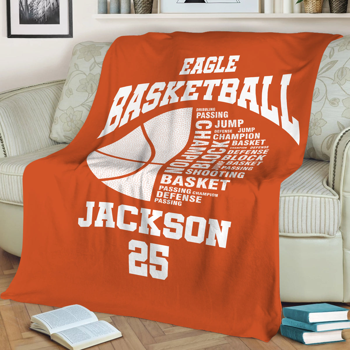 Orange basketball blanket draped over a sofa with large basketball graphics and sporty room decor