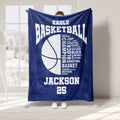 Navy basketball throw blanket shown indoors with bold basketball artwork and sports typography