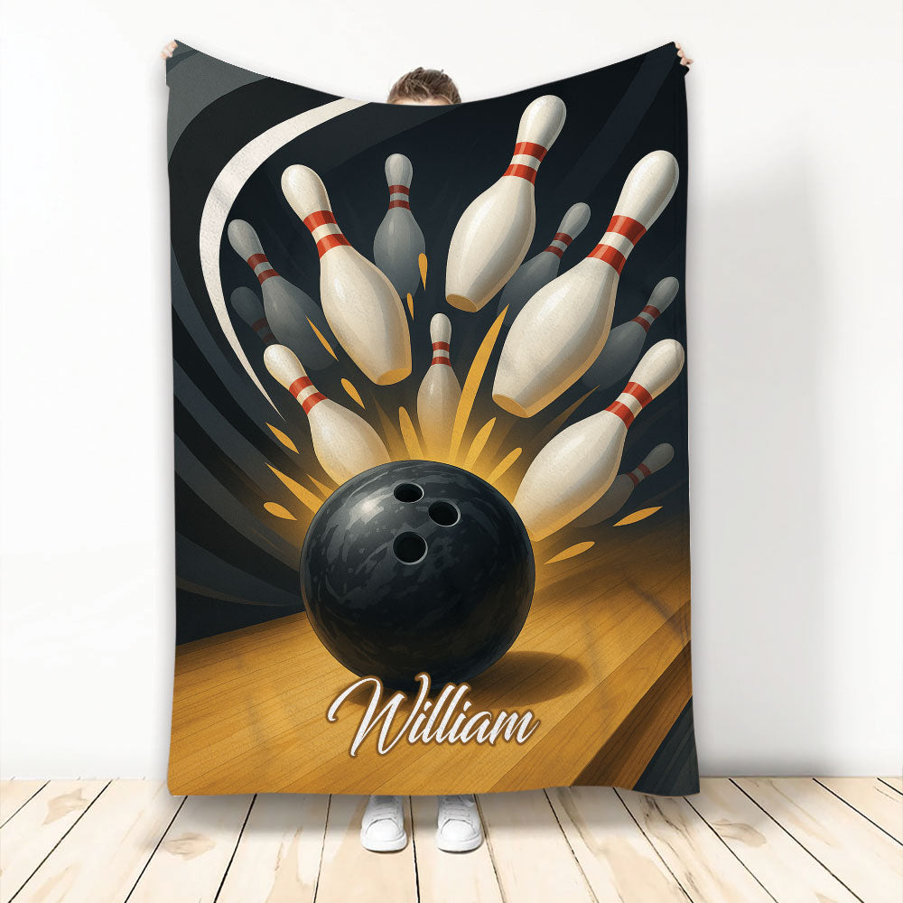 Bowling throw blanket featuring a black bowling ball striking red-striped pins on a dark lane