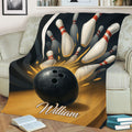 Bowling throw blanket draped over a sofa, showcasing dramatic bowling ball and pin artwork
