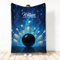 Bowling throw blanket displayed upright with a black bowling ball, pins, and vivid blue flame artwork