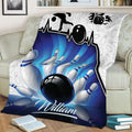 Close view of bowling throw blanket featuring a bowler silhouette, ball, and pins