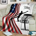 Patriotic disc golf blanket draped over a sofa with player silhouette and disc basket design