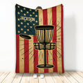 Disc golf blanket with basket, flying disc, stars, and patriotic red, cream, and navy artwork