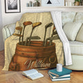 Golf blanket draped over a sofa, showing vintage golf clubs and bag artwork in a cozy living room