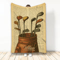 Golf throw blanket featuring vintage illustrated clubs in a leather golf bag with warm sepia book-page artwork