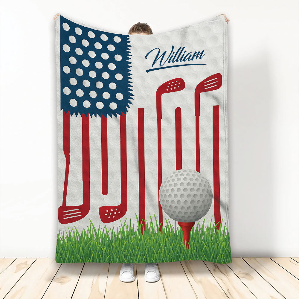 Patriotic golf blanket featuring golf clubs, a golf ball on a tee, grass, and American flag colors