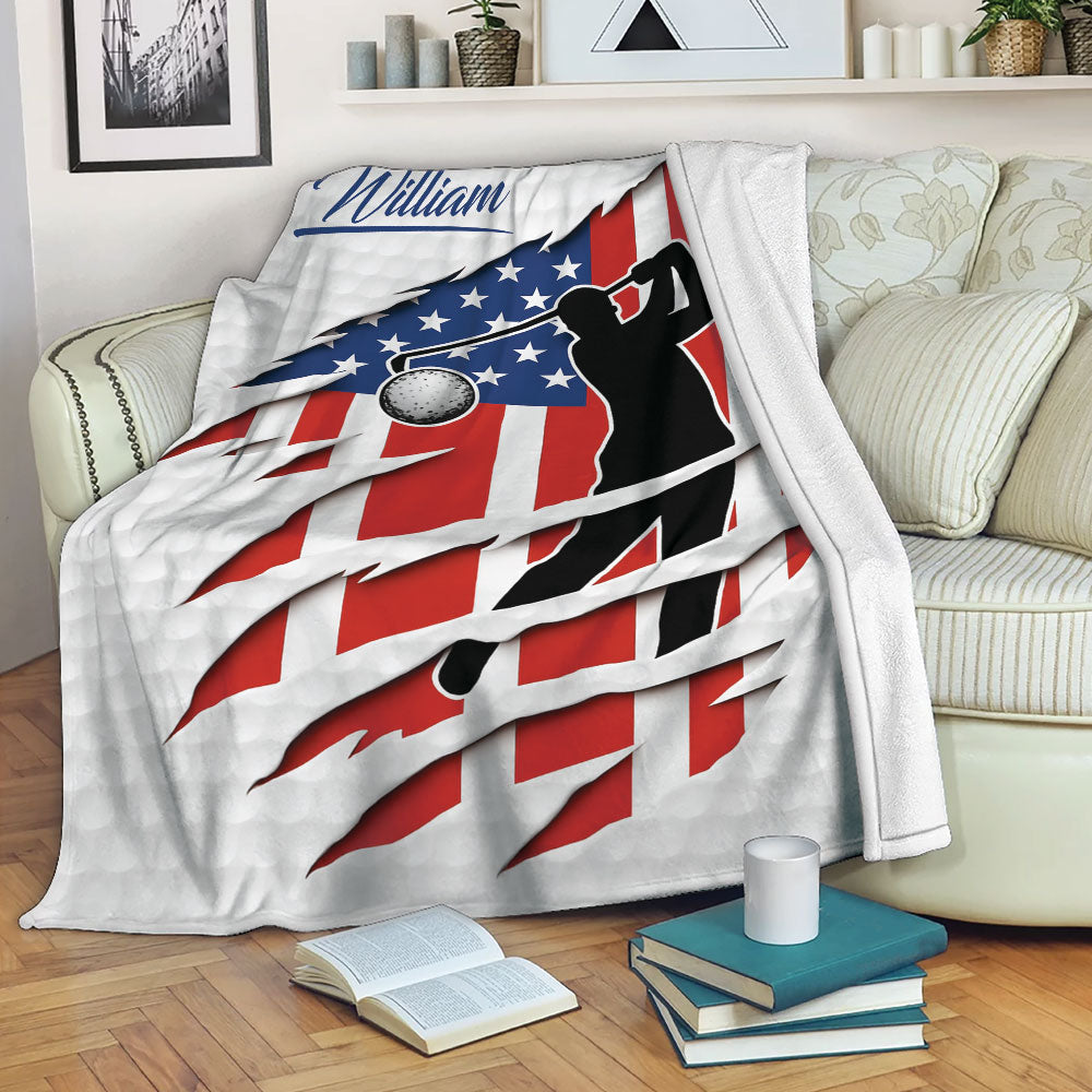 Patriotic golf blanket draped over a sofa, showing a golfer silhouette and American flag artwork