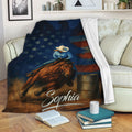 Barrel racing blanket draped over a sofa with horse and rider artwork in a patriotic theme
