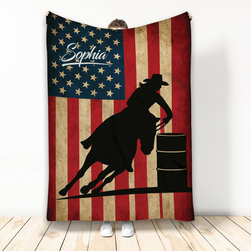 Barrel racing blanket with a cowgirl silhouette, horse, barrel, stars, and patriotic red white and blue artwork