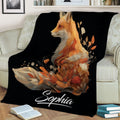 Custom fox blanket displayed on a sofa with detailed floral foliage and warm autumn colors