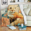Fox blanket draped over a sofa, featuring a floral woodland design in teal, orange and cream