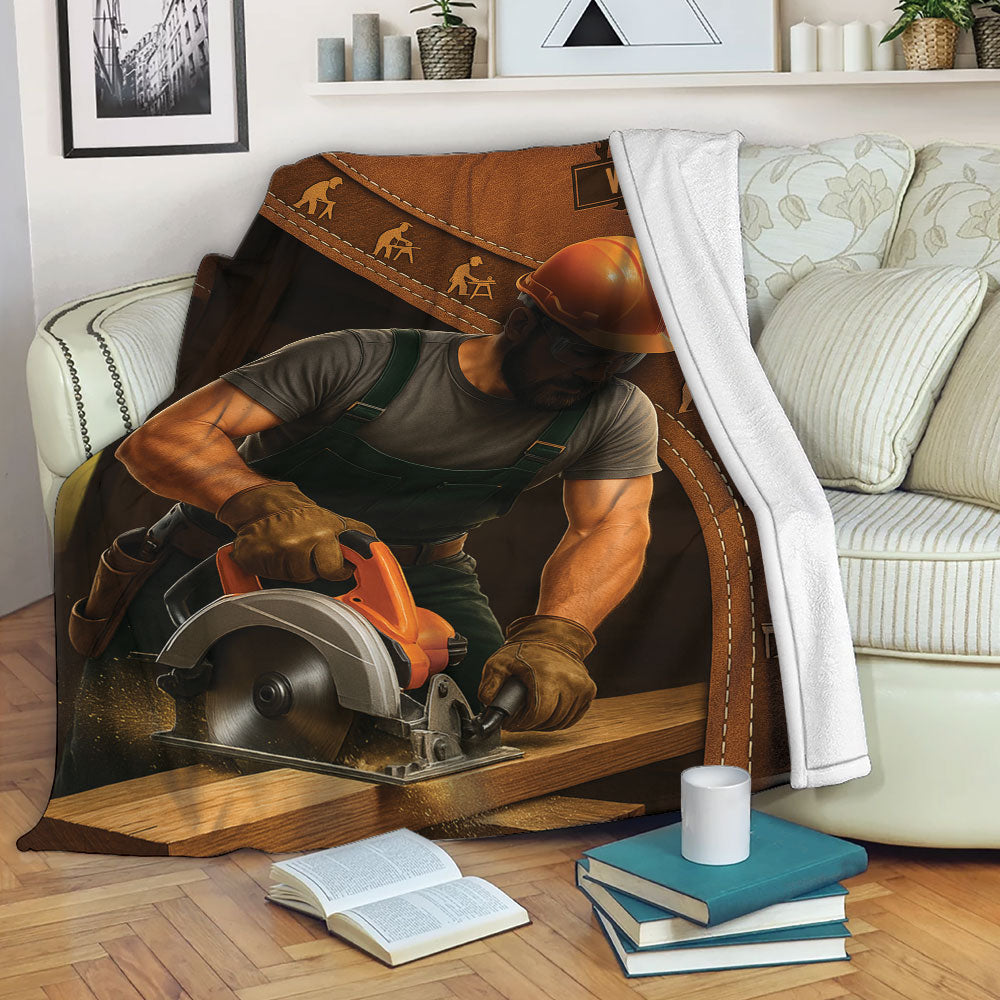 Carpenter blanket displayed on a sofa with a craftsman, lumber, tools and warm rustic artwork