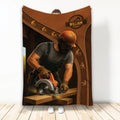 Carpenter throw blanket featuring a craftsman using a circular saw with rustic woodgrain artwork