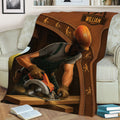 Rustic carpenter throw blanket draped over a sofa with woodworking tools and craftsman artwork
