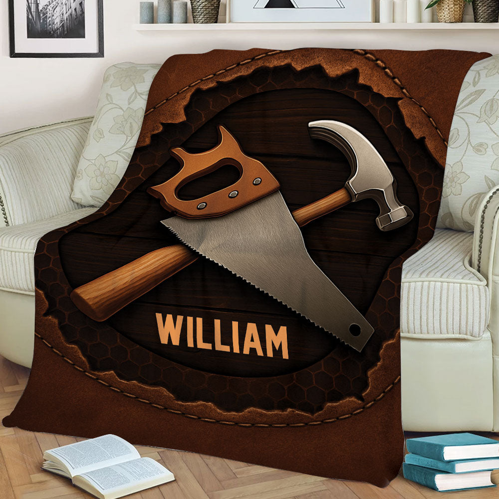 Rustic carpenter throw blanket displayed on a sofa with woodworking tool artwork