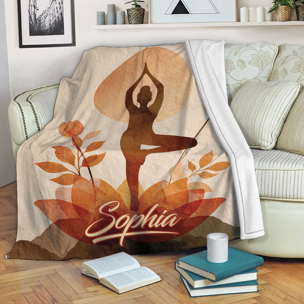 Yoga blanket draped over a sofa with a graceful pose, orange foliage, and warm autumn colors