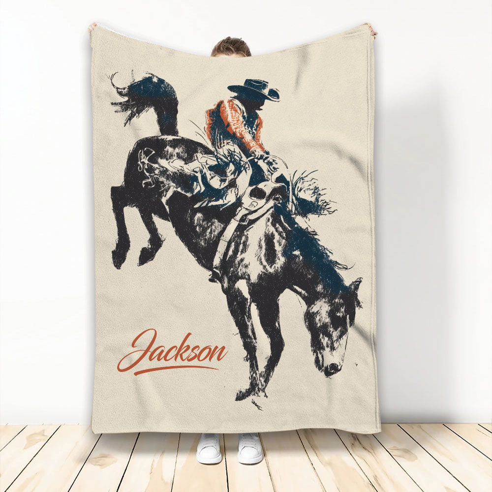 Rodeo throw blanket featuring a bull rider on a bucking bull in rustic western artwork