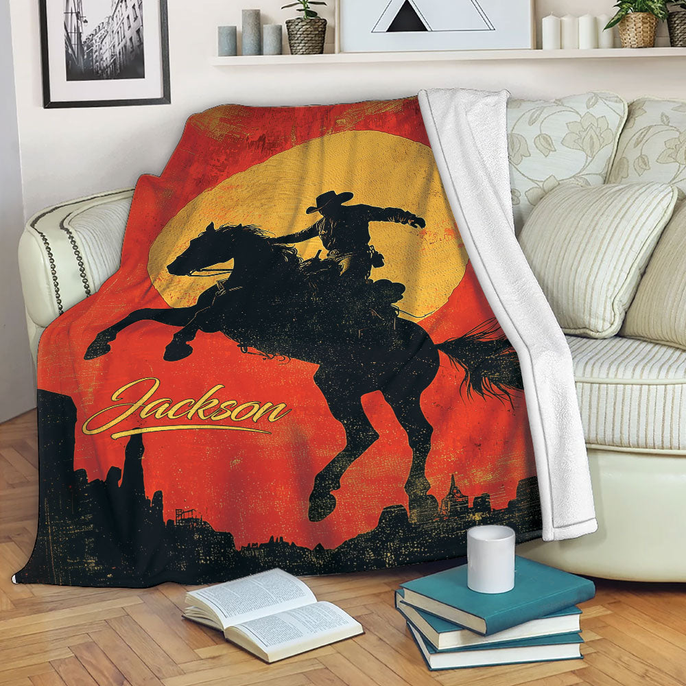 Rodeo throw blanket draped over a sofa with a cowboy and horse silhouette in bold western colors
