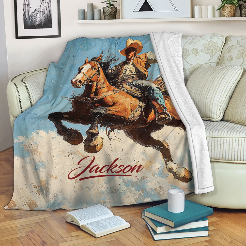 Rodeo blanket draped over a sofa with a cowboy and bucking horse design in warm western tones