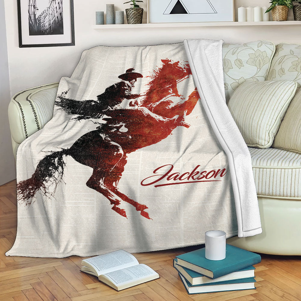 Rodeo bull riding blanket draped over a sofa with bold vintage western artwork