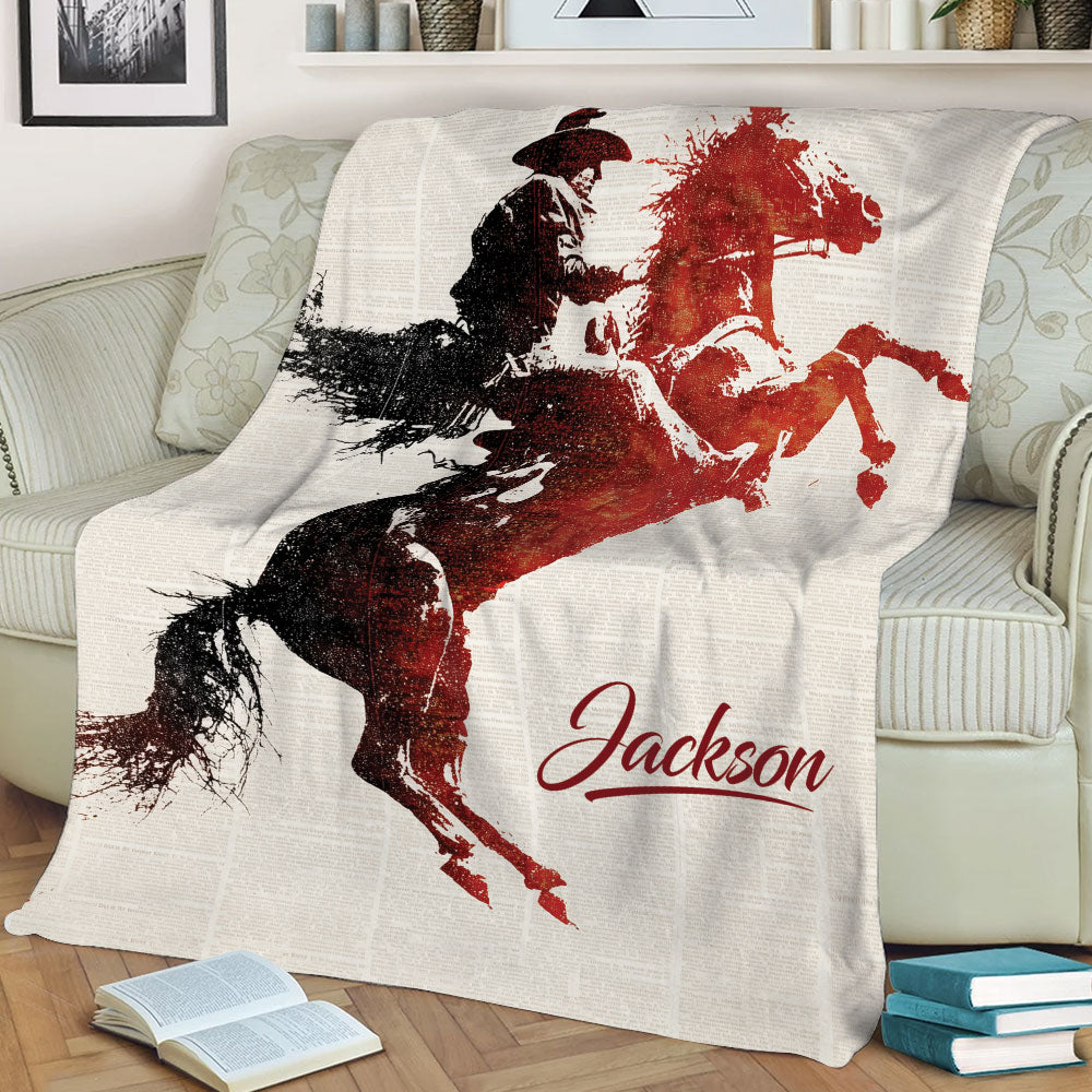 Western rodeo throw blanket displayed on a couch with dynamic bull rider artwork