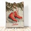 Ice skating blanket featuring red skate artwork against a rustic wood and evergreen background