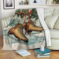 Ice skating throw blanket featuring vintage skates and winter holly artwork draped over a sofa