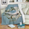 Ice skating throw blanket displayed on a sofa with floral skate artwork