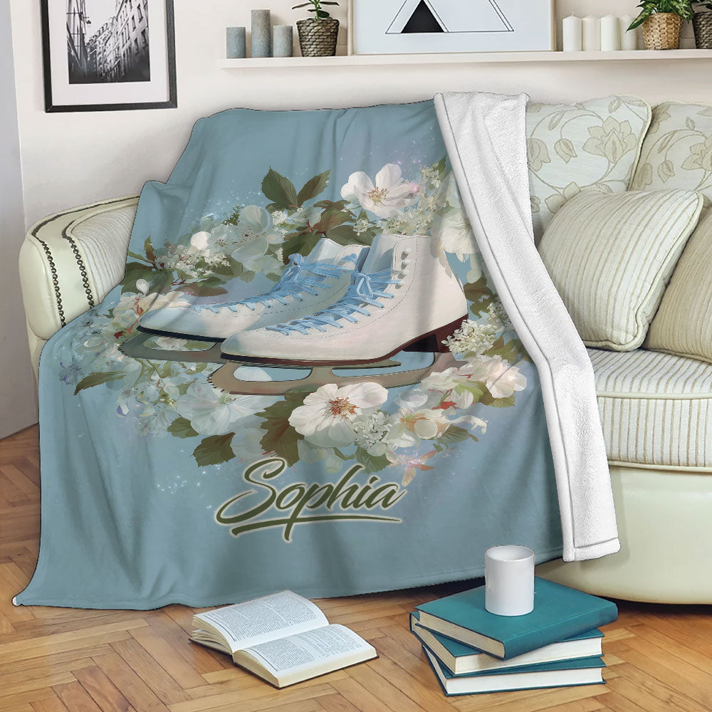 Ice skating throw blanket displayed on a sofa with floral skate artwork