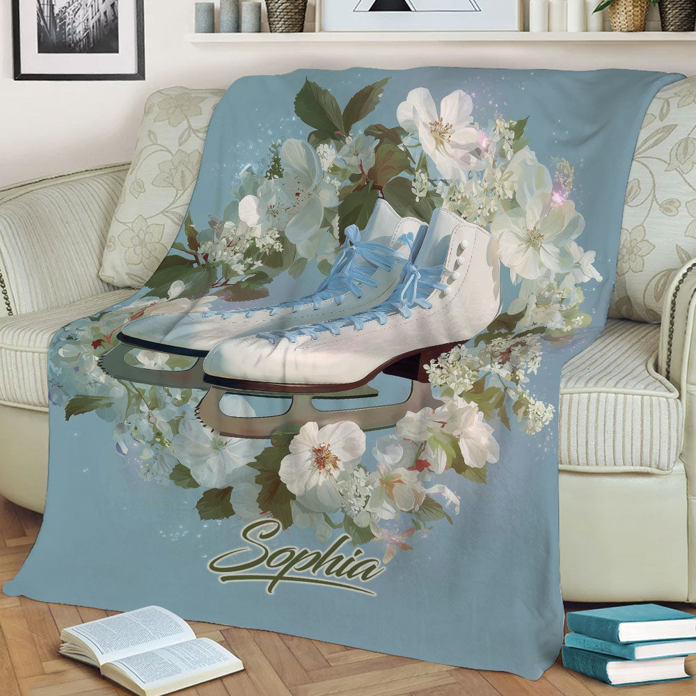 Floral ice skating blanket draped over a sofa with detailed figure skates