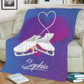 Blue and purple ice skating blanket displayed on a couch with crossed white skates