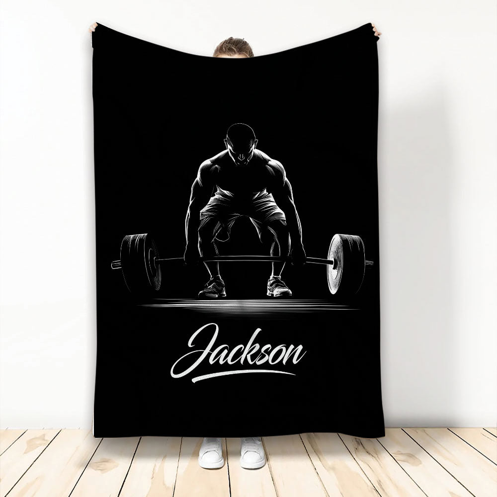 Black weightlifting blanket featuring white barbell deadlift artwork on a bold monochrome design