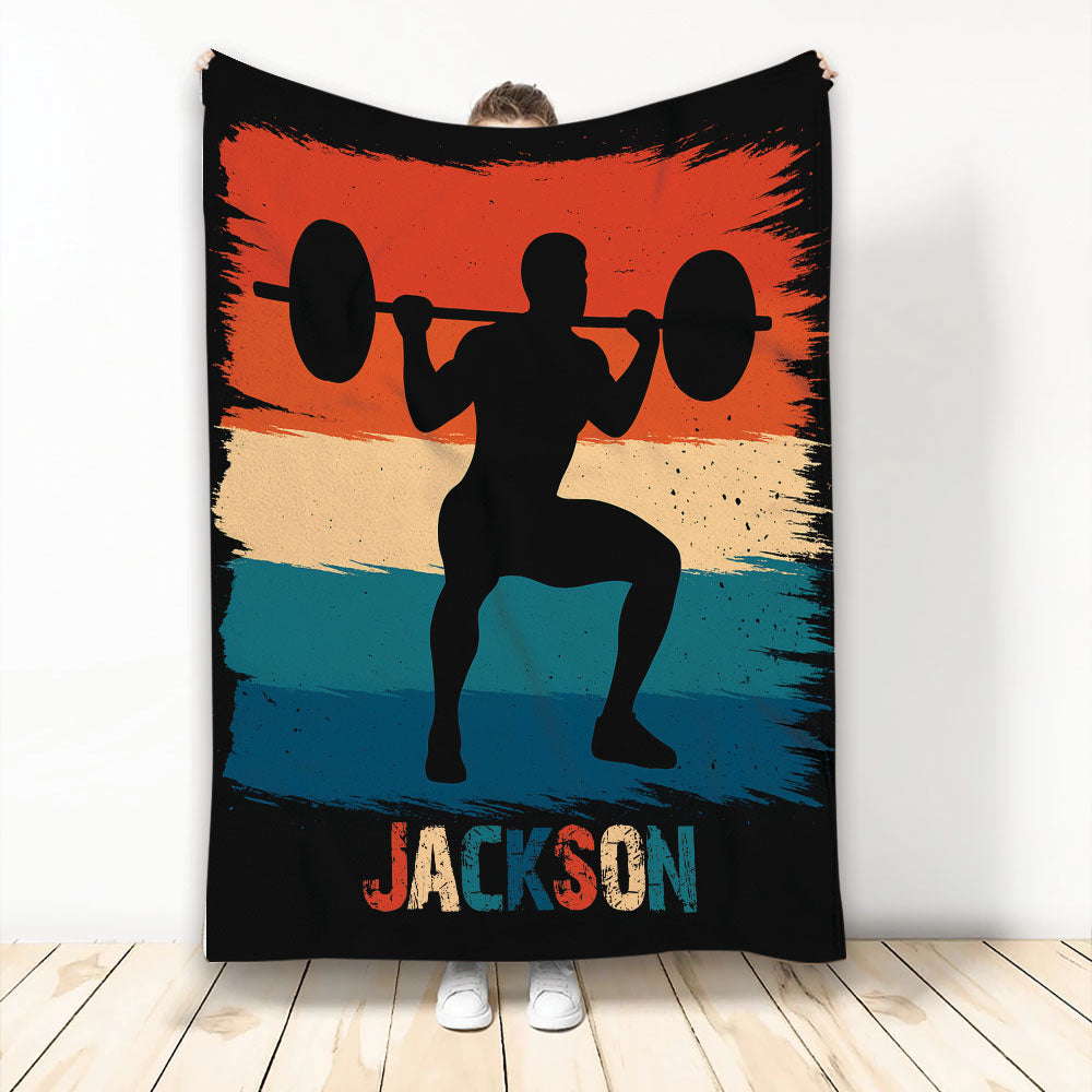 Weightlifting throw blanket with barbell lifter silhouette and bold orange, cream, teal, and black artwork