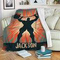 Weightlifting blanket displayed on a sofa with bold barbell artwork, red sunburst accents, and vintage distressed styling