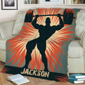 Close lifestyle view of a weightlifting throw blanket featuring a powerful barbell silhouette and retro athletic artwork