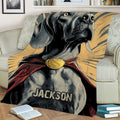 Close view of a Weimaraner throw blanket with detailed dog artwork, cape-inspired design and radiant background