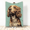 English Cocker Spaniel artwork on a teal blanket shown being held upright