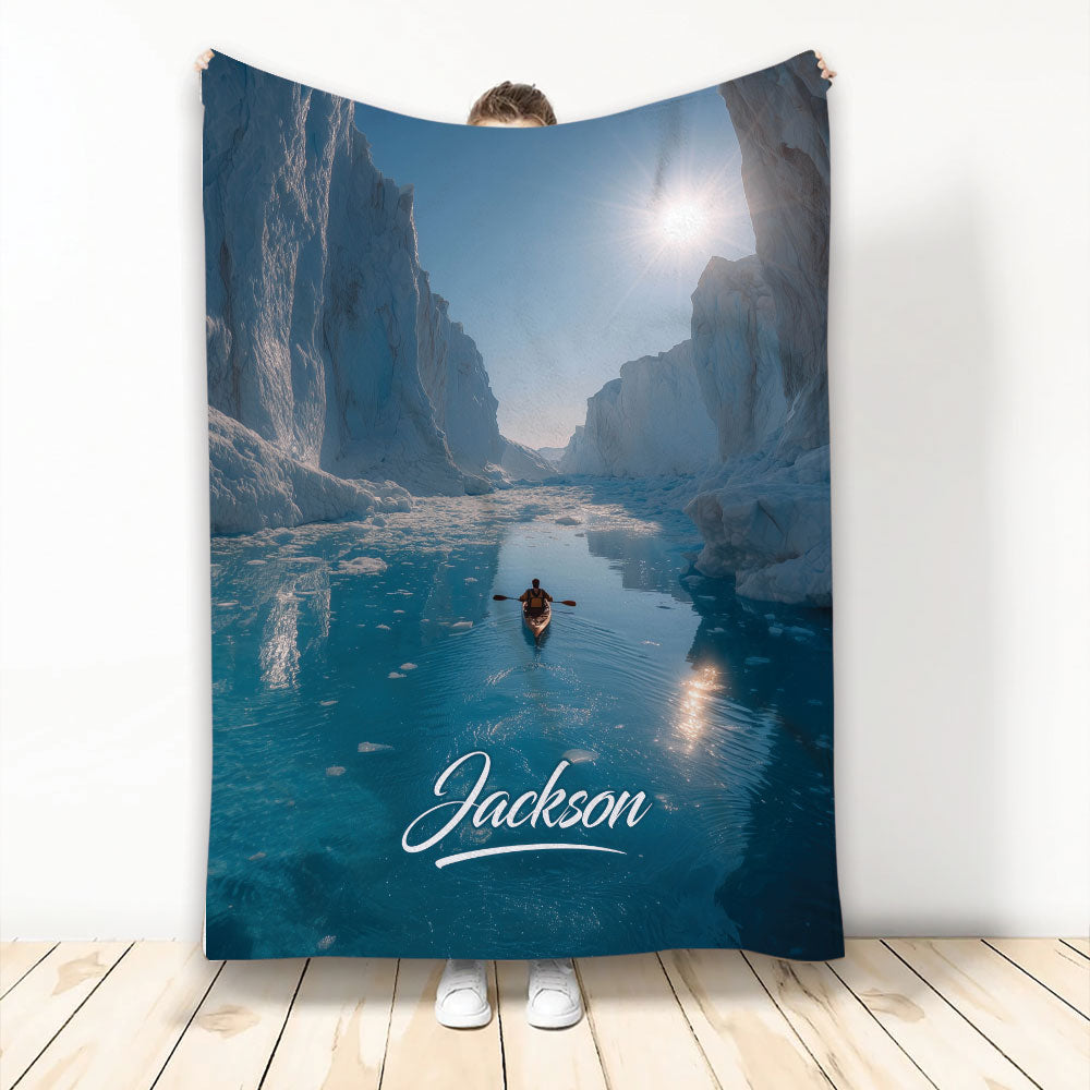 Kayak blanket featuring a blue icy canyon scene with a small kayaker on the water