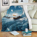 Kayak blanket draped over a sofa with an action scene of paddlers on the water