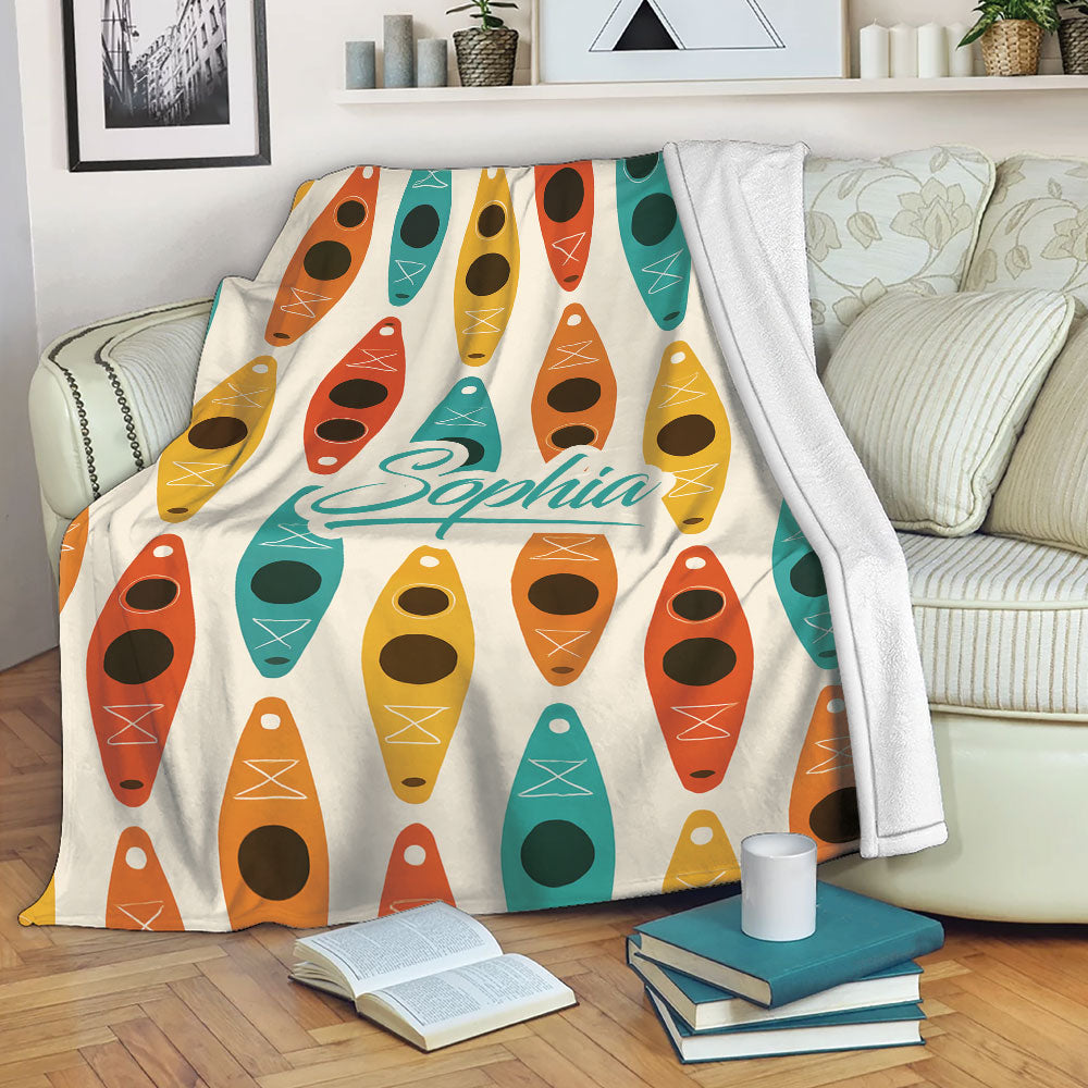 Colorful kayak throw blanket draped over a sofa in a cozy living room