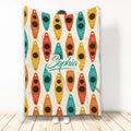 Colorful kayak pattern blanket displayed vertically with bright teal, orange, red, and yellow artwork